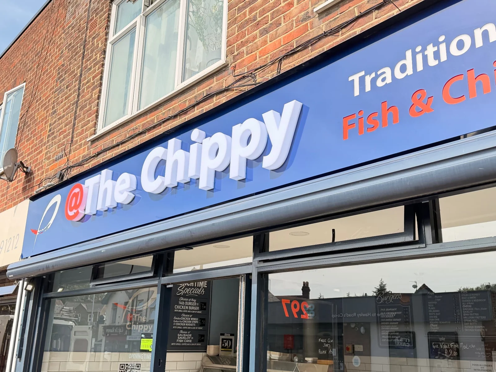 Lettering detail: close-up in daylight showing the depth of the built-up acrylic letters on The Chippy fascia