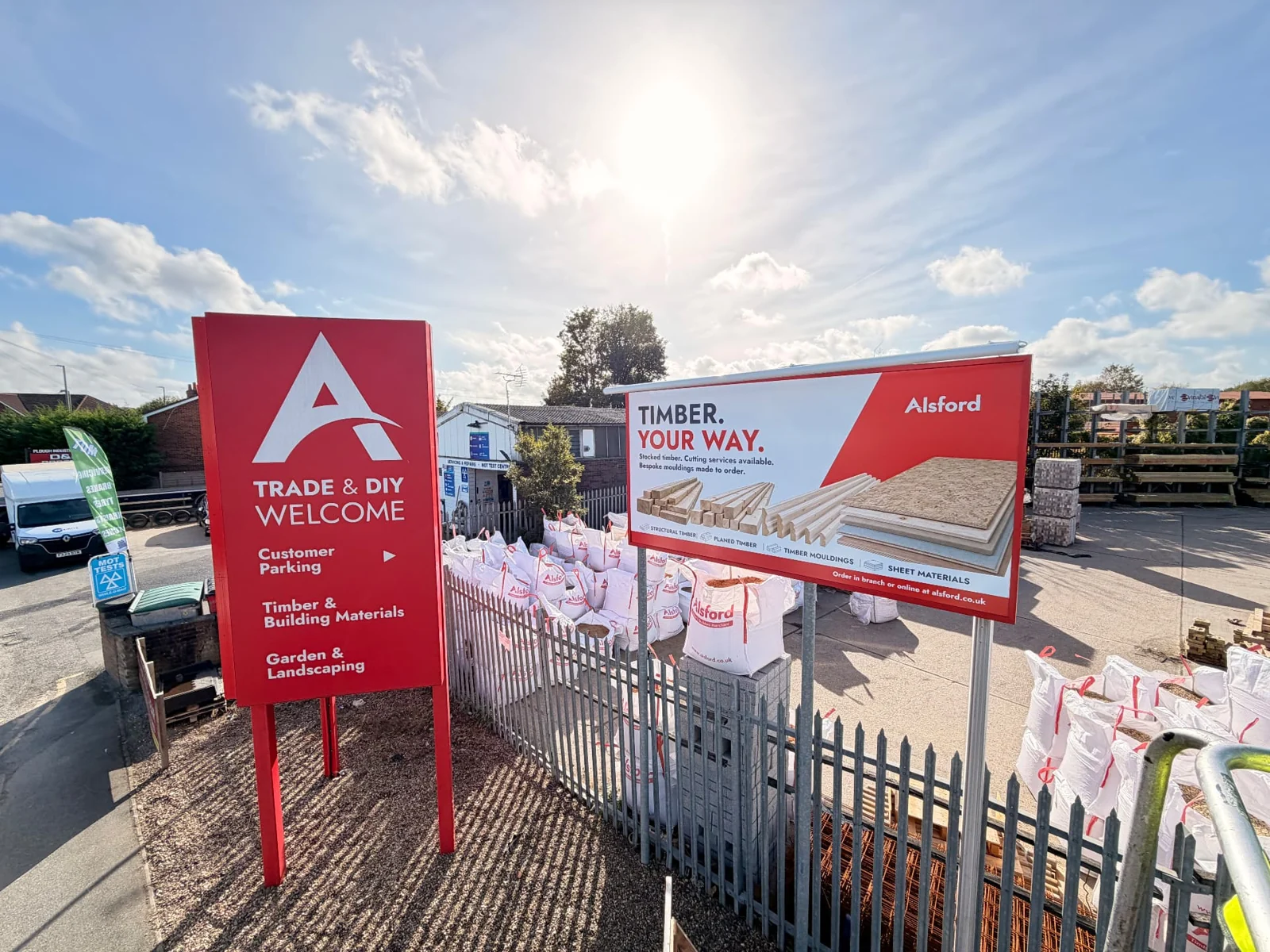 Freestanding Alsford campaign billboard beside a timber yard