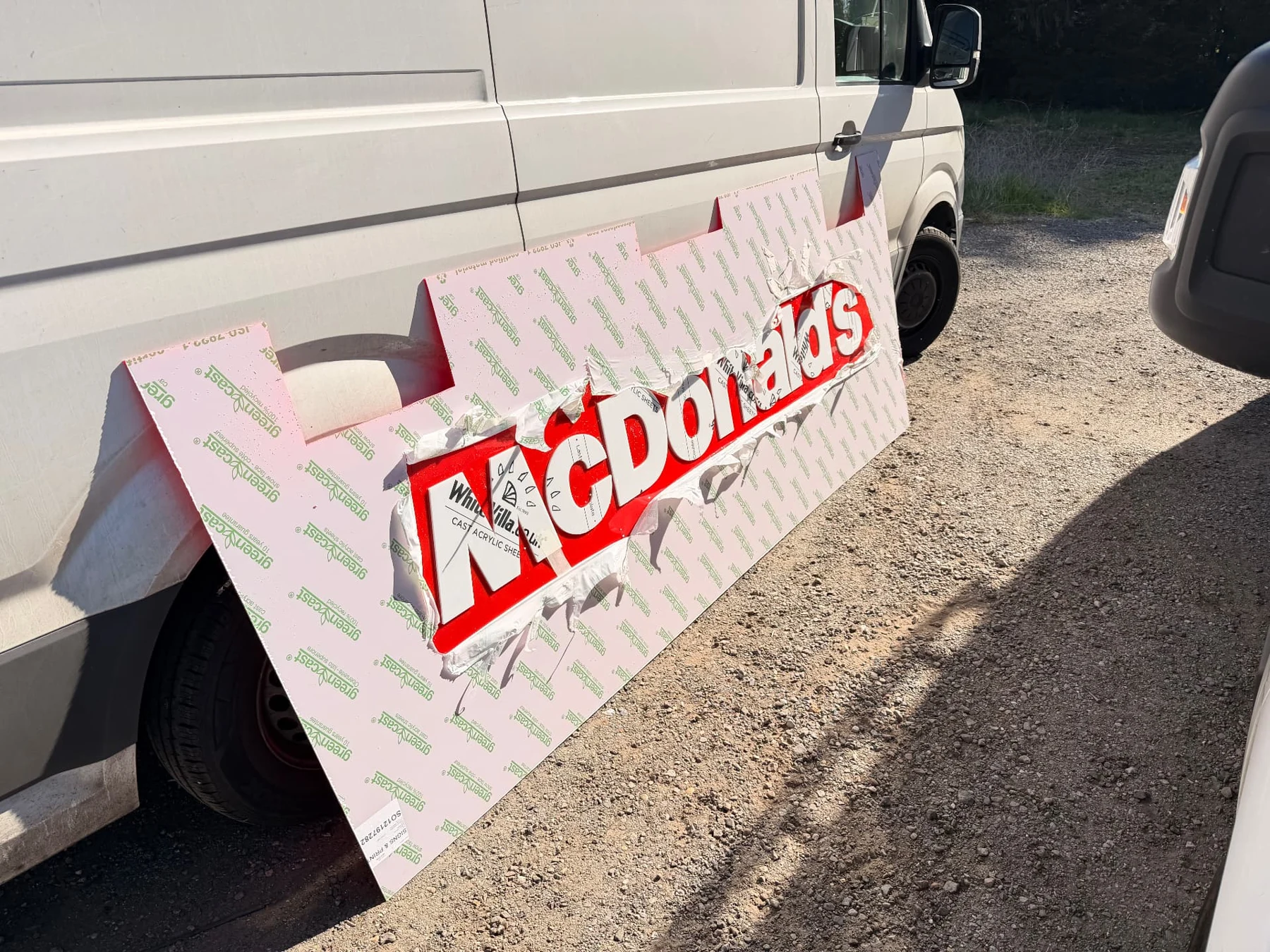 Assembled McDonald’s totem sign face with protective masking still covering the acrylic surface