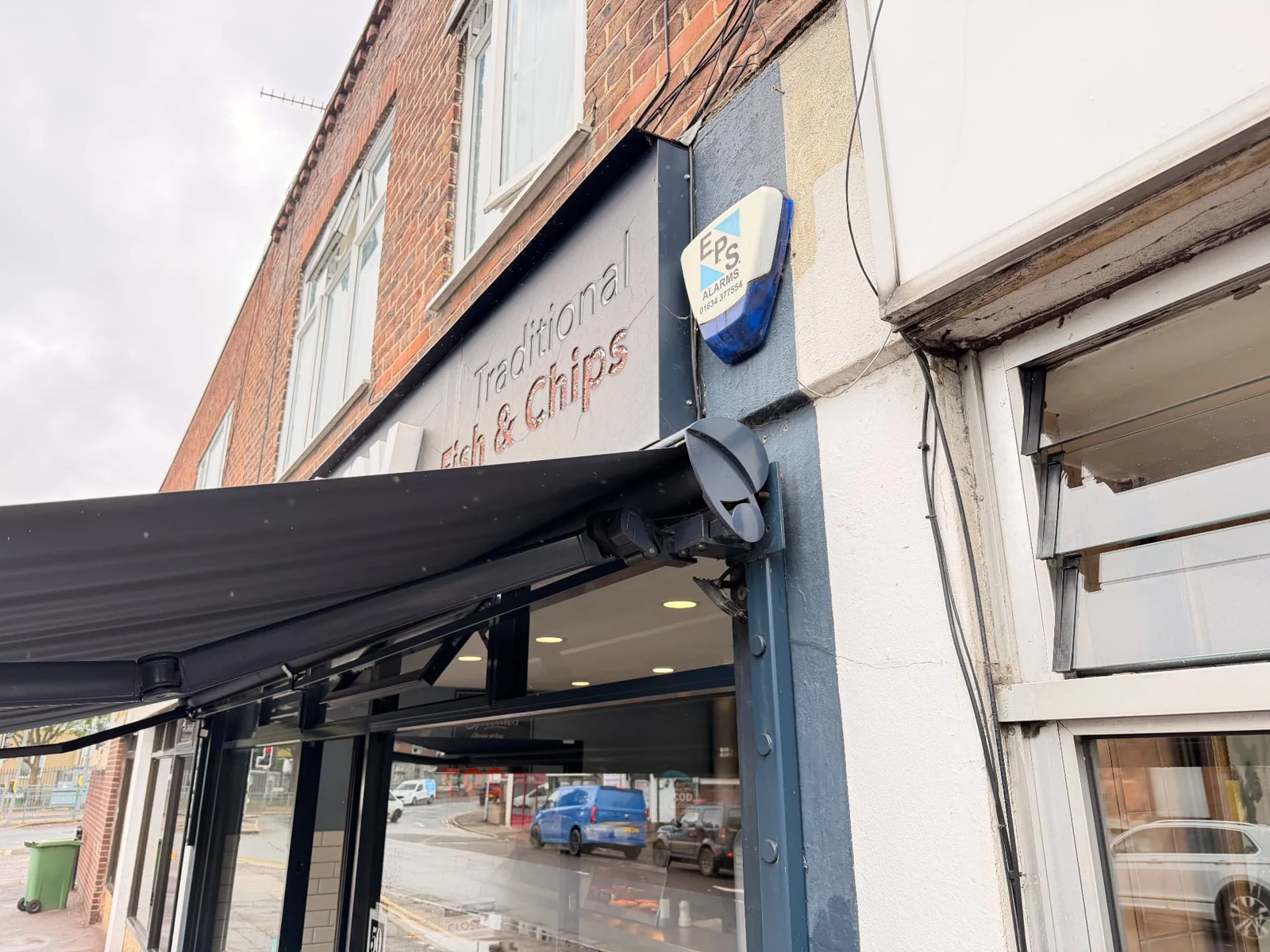Before detail: angled view of The Chippy’s old weathered fascia