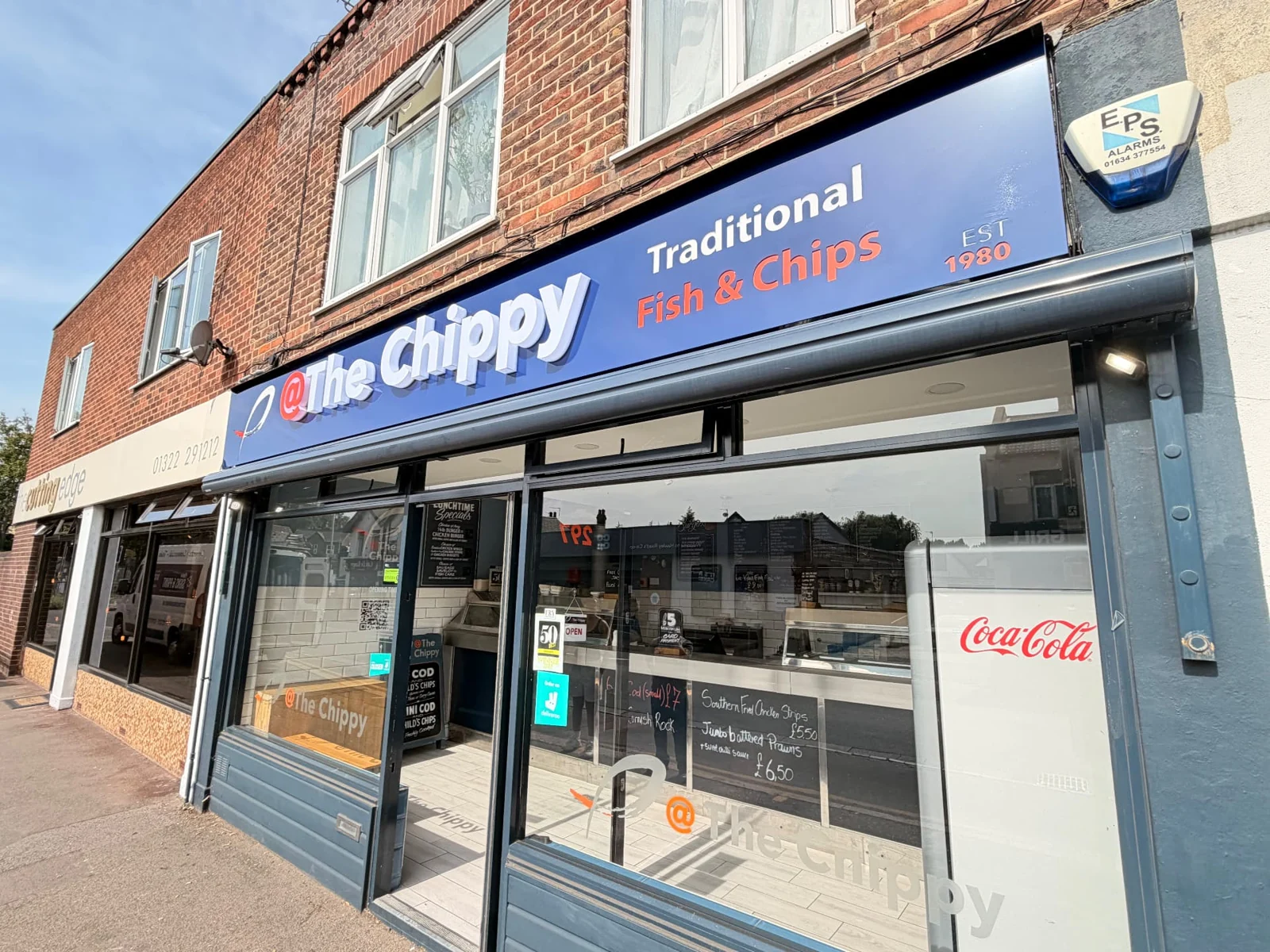 Completed installation: angled daylight view of The Chippy’s new blue fascia and acrylic lettering