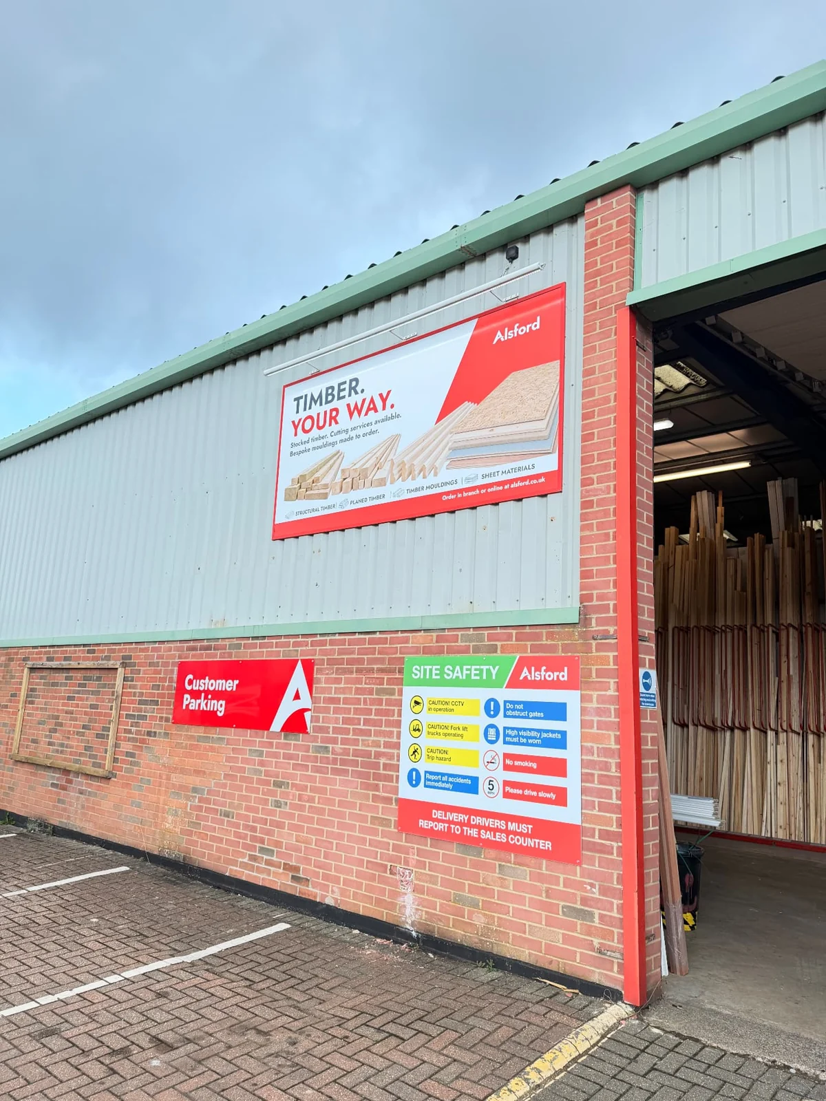 Alsford campaign billboard mounted high on a clad building