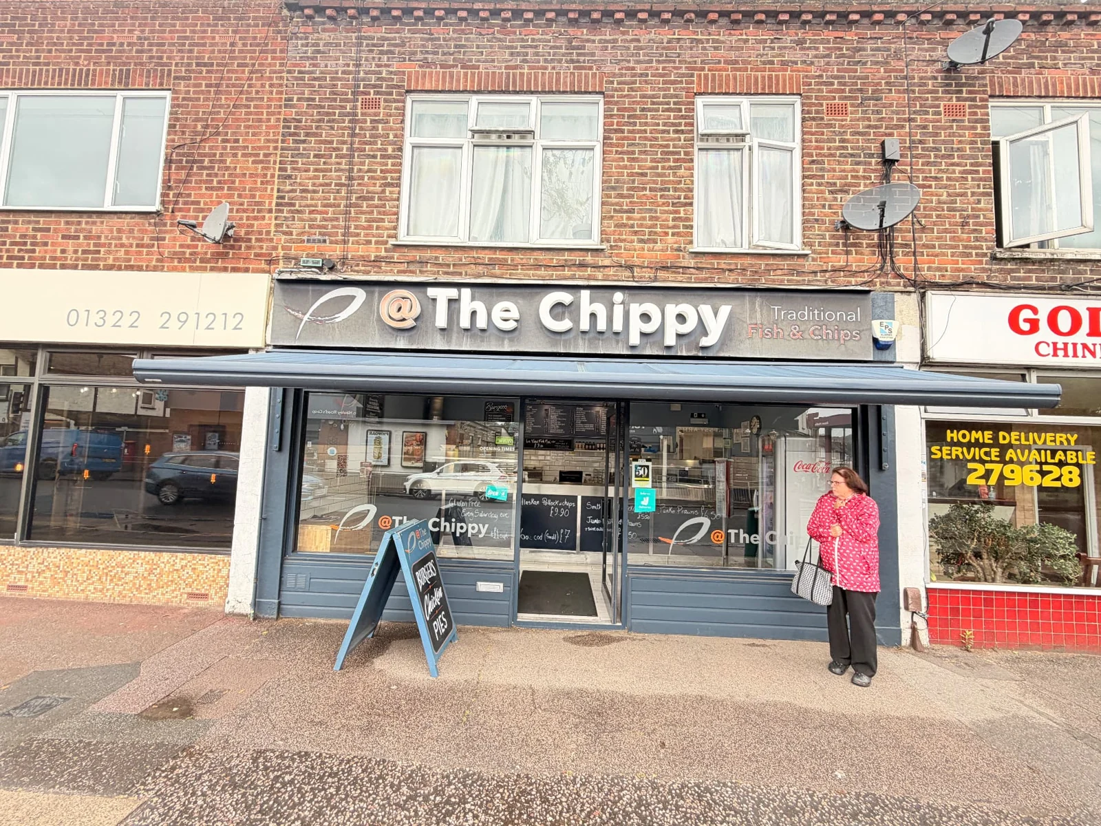 Before: The Chippy’s original weathered shopfront fascia before replacement