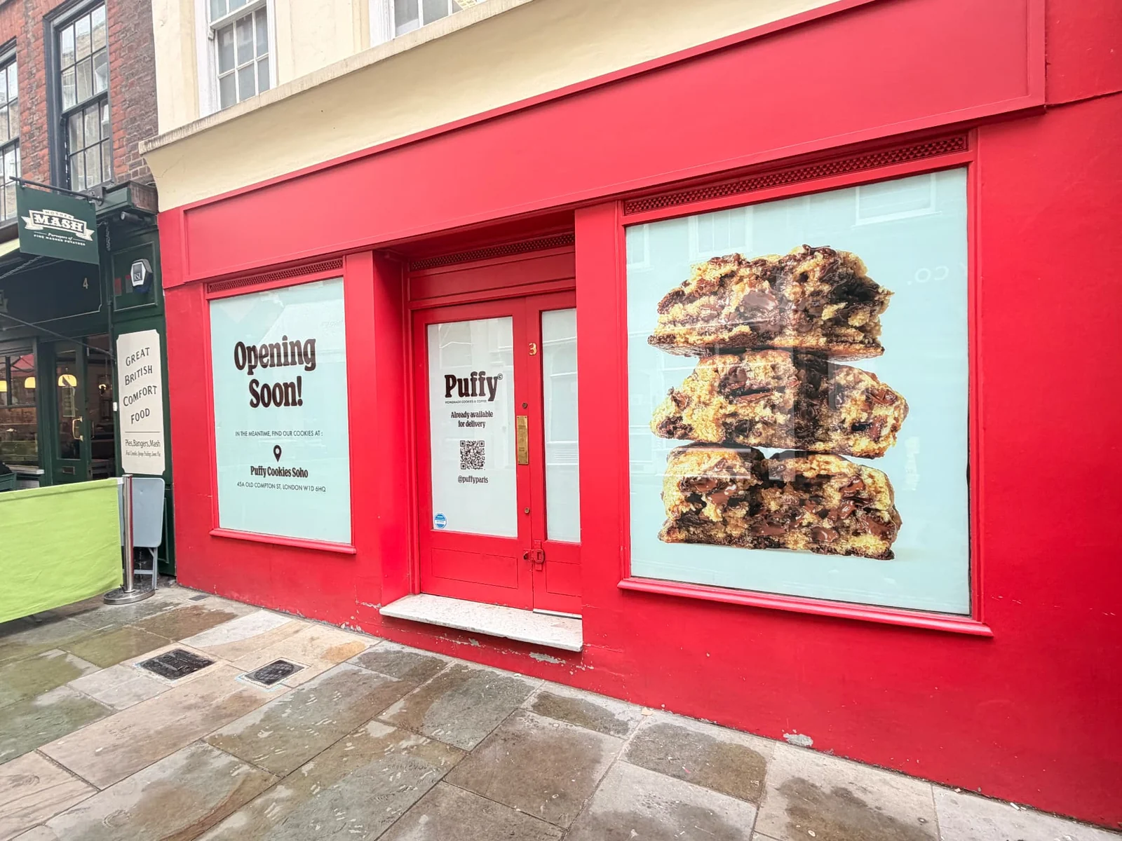Puffy opening-soon window and door vinyl on a red painted shopfront
