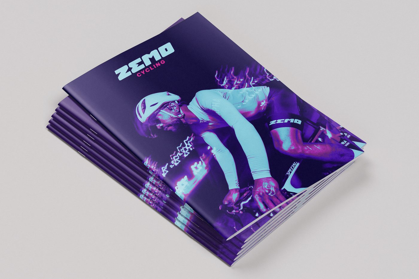 Stack of stapled booklets with full-colour covers